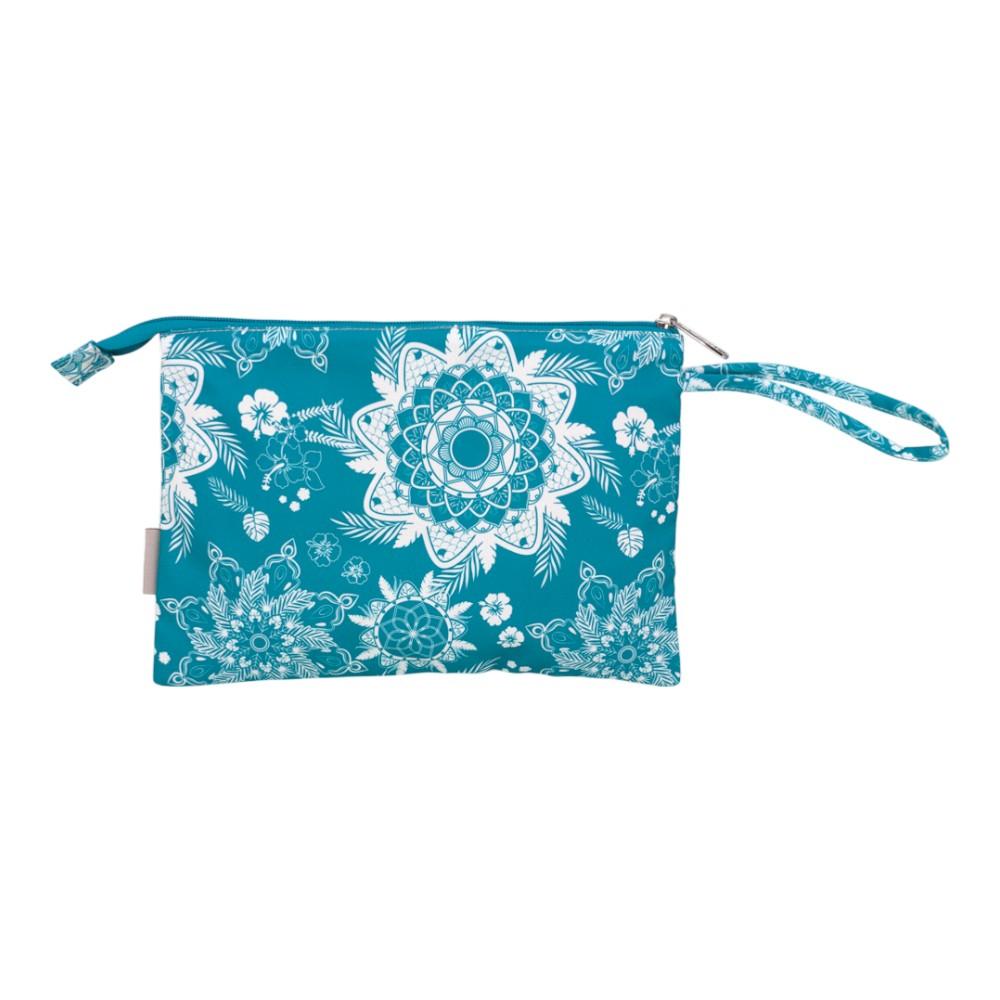 Parte trasera del bolso manteniendo el mismo estampado azul turquesa y crudo, mostrando el reverso del asa de mano.