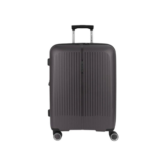 Vista frontal de la maleta mediana Gabol Brooklyn en color gris oscuro, fabricada en polipropileno de alta resistencia con cuatro ruedas dobles multidirección, ideal para viajes de 5 a 7 días.