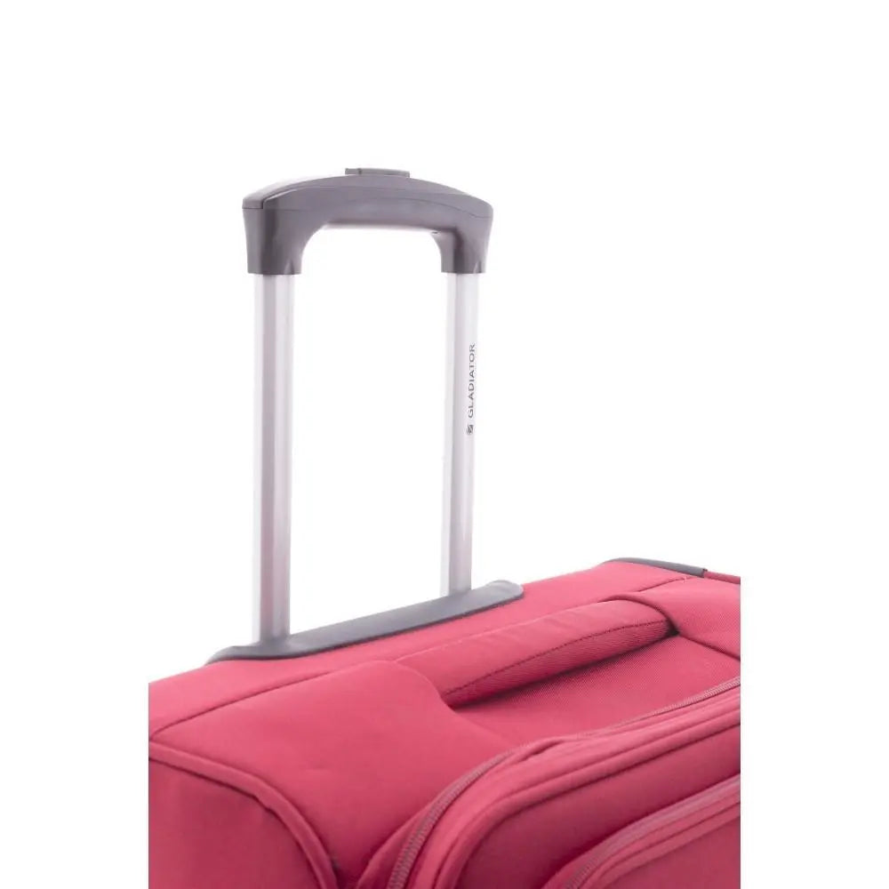 Plano corto de la parte superior de la maleta, mostrando el asa de carga acolchada y el inicio del tirador telescópico de aluminio.