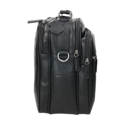Detalle del lateral del bolso Matties Nappa con anclajes metálicos para la bandolera regulable y estructura resistente para un uso intensivo.