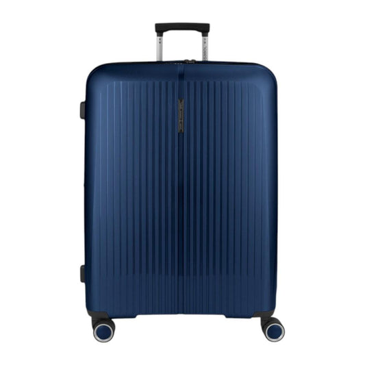 Vista frontal de la maleta grande Gabol Brooklyn en color azul marino, fabricada en polipropileno de alta resistencia con cuatro ruedas dobles multidirección, perfecta para viajes largos, vacaciones en familia o estancias Erasmus.