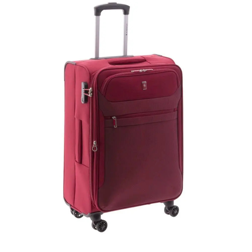 Perspectiva de tres cuartos que permite apreciar el volumen y el perfil lateral de la maleta de tela roja y su asa superior.