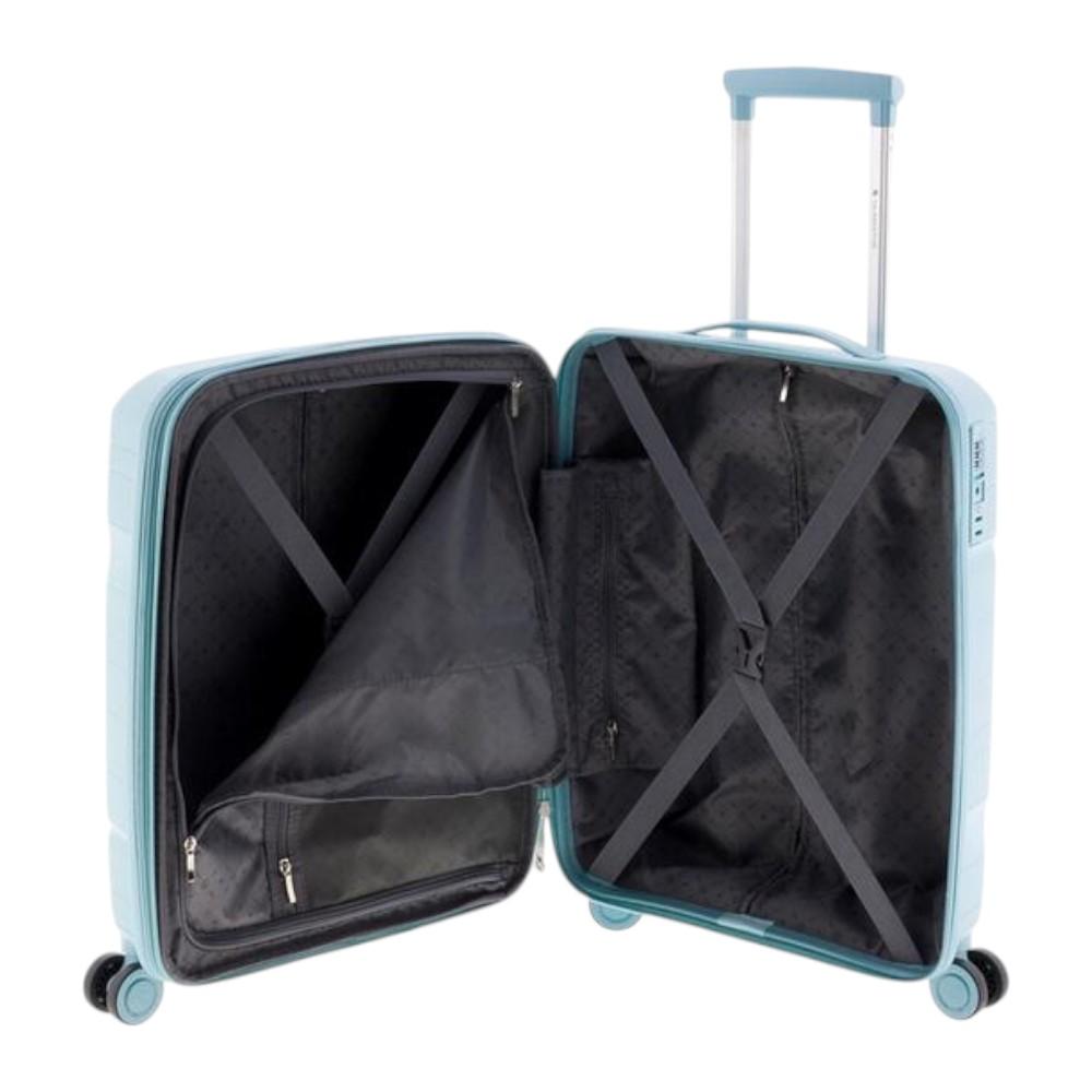 Vista del interior organizado de la maleta azul cielo Boxing con forro gris, bolsillos de malla y cintas elásticas.