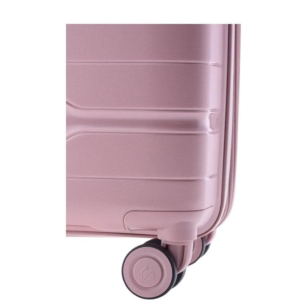 Primer plano de las ruedas dobles con amortiguación de la maleta Boxing rosa para un rodaje suave.
